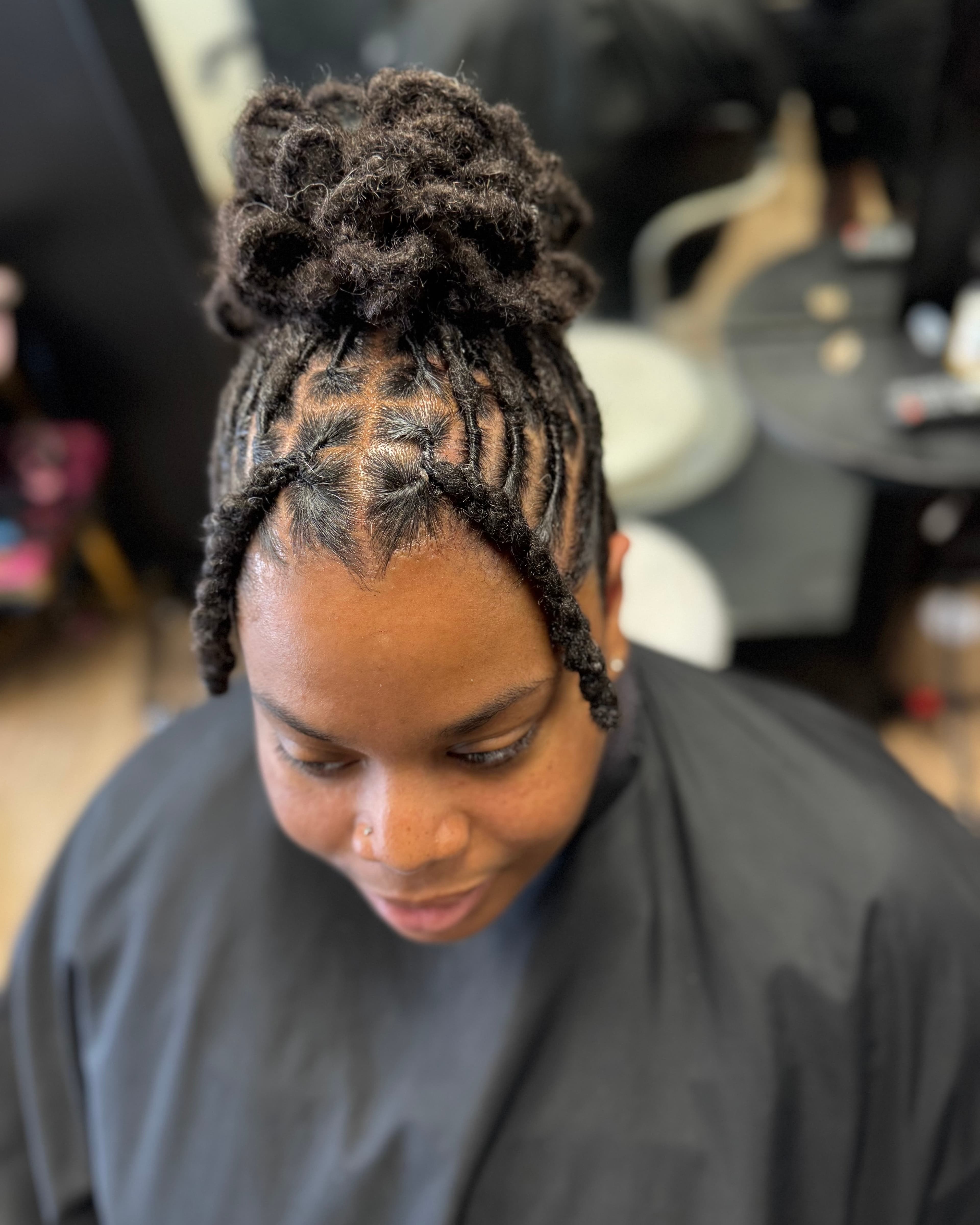 Loc palm roll with double strands and petal bun — before
